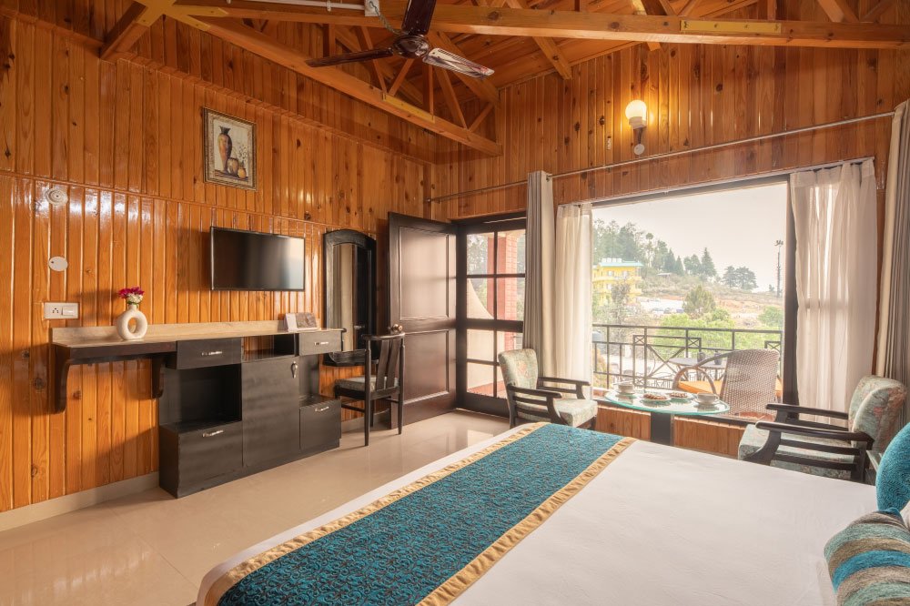 Executive Jacuzzi Room at Ojaswi Resort Mukteshwar, featuring a private garden sit-out and luxury amenities.