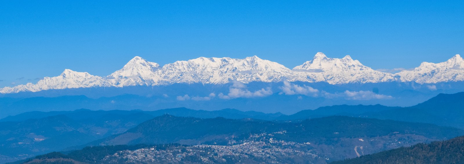 Panoramic snow-capped Himalayan mountain range view from Mukteshwar Uttarakhand