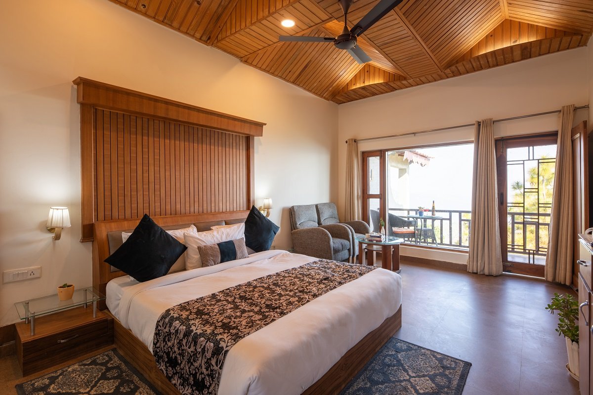 Spacious Terrace Room at Ojaswi Resort Mukteshwar, offering beautiful mountain views for families and groups.